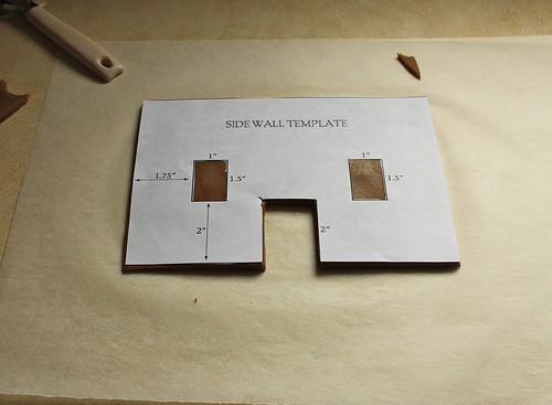 Side wall template on gluten-free gingerbread house dough.