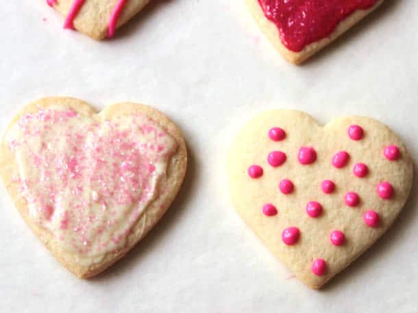 Gluten-free sugar cookies iced with frosting and polka dots.