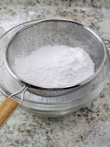 Sifting corn-free powdered sugar.