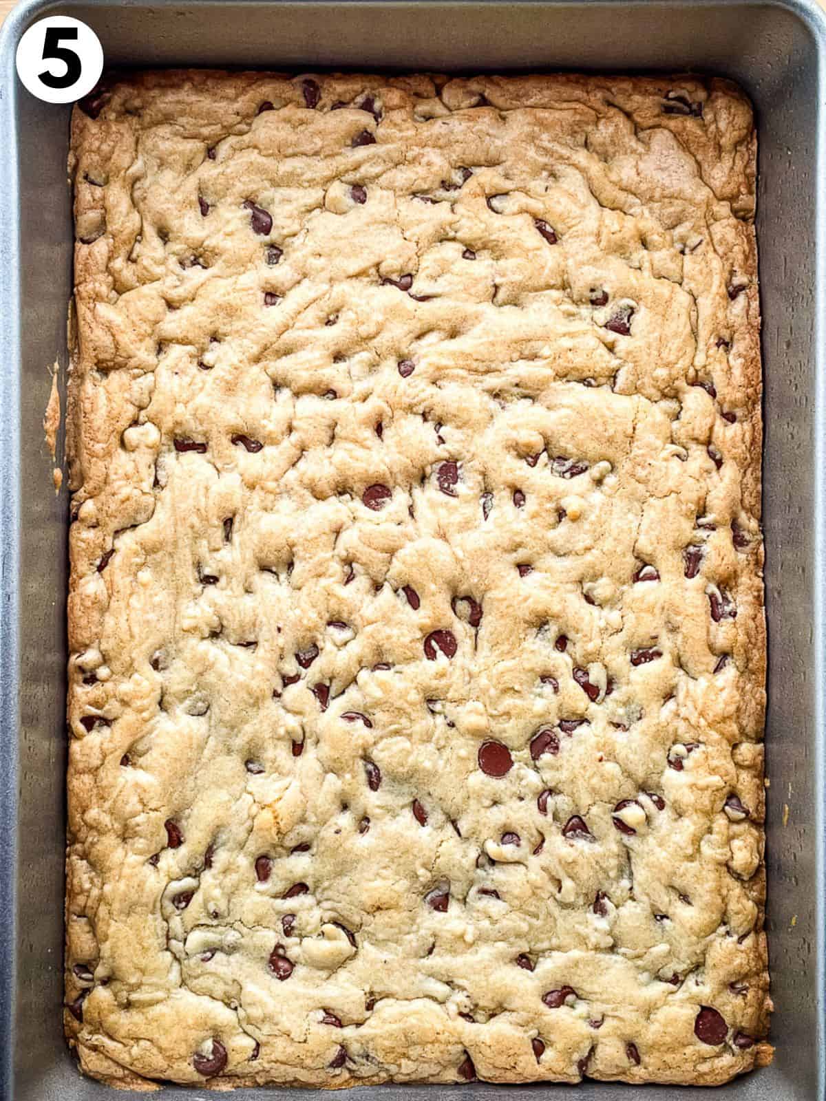 Gluten-free chocolate chip cookie bars baked in a pan.