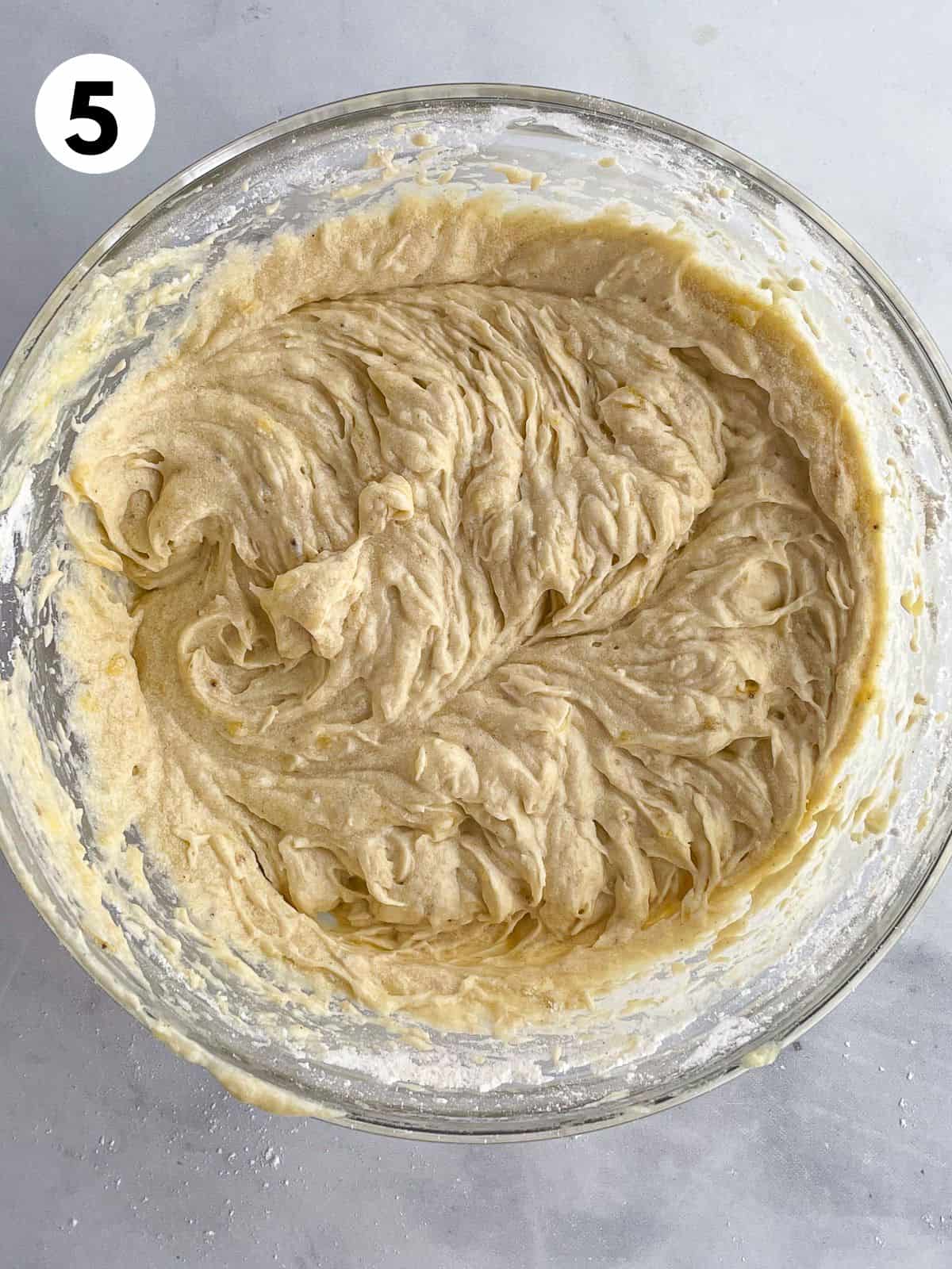 Gluten-free banana bread batter in a bowl.