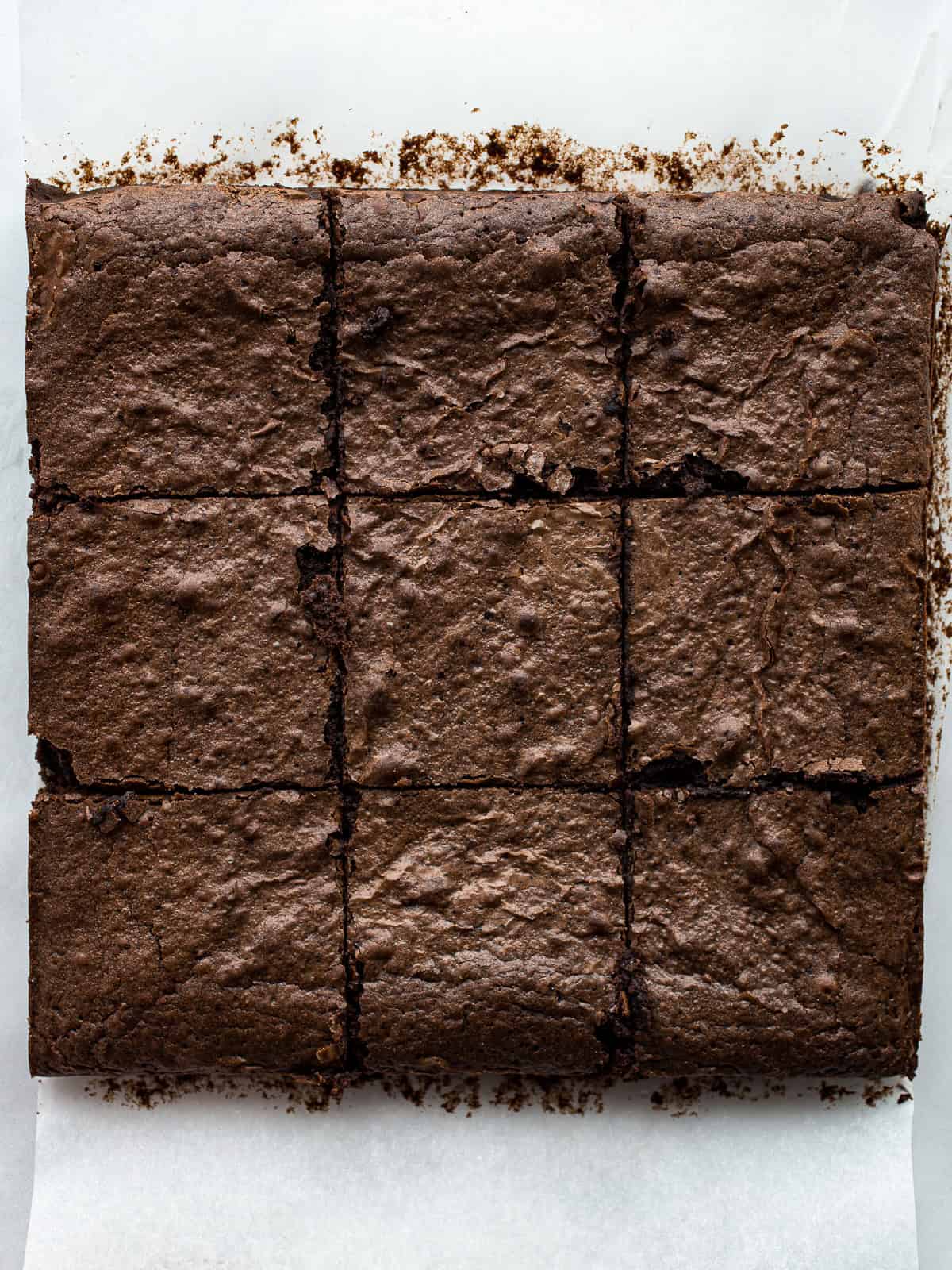 Gluten-free brownies cut into squares on the counter.