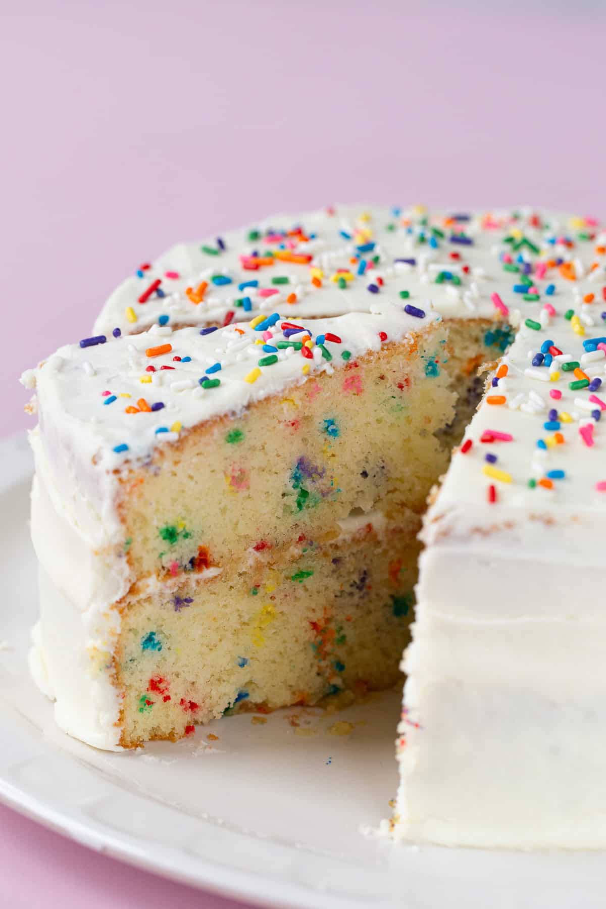Gluten-free confetti cake on a cake plate.