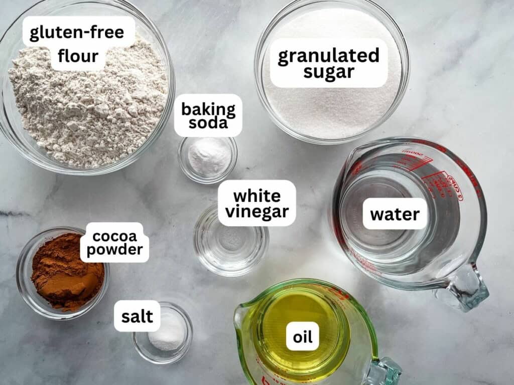 Ingredients for gluten-free and egg-free chocolate cake on the counter.