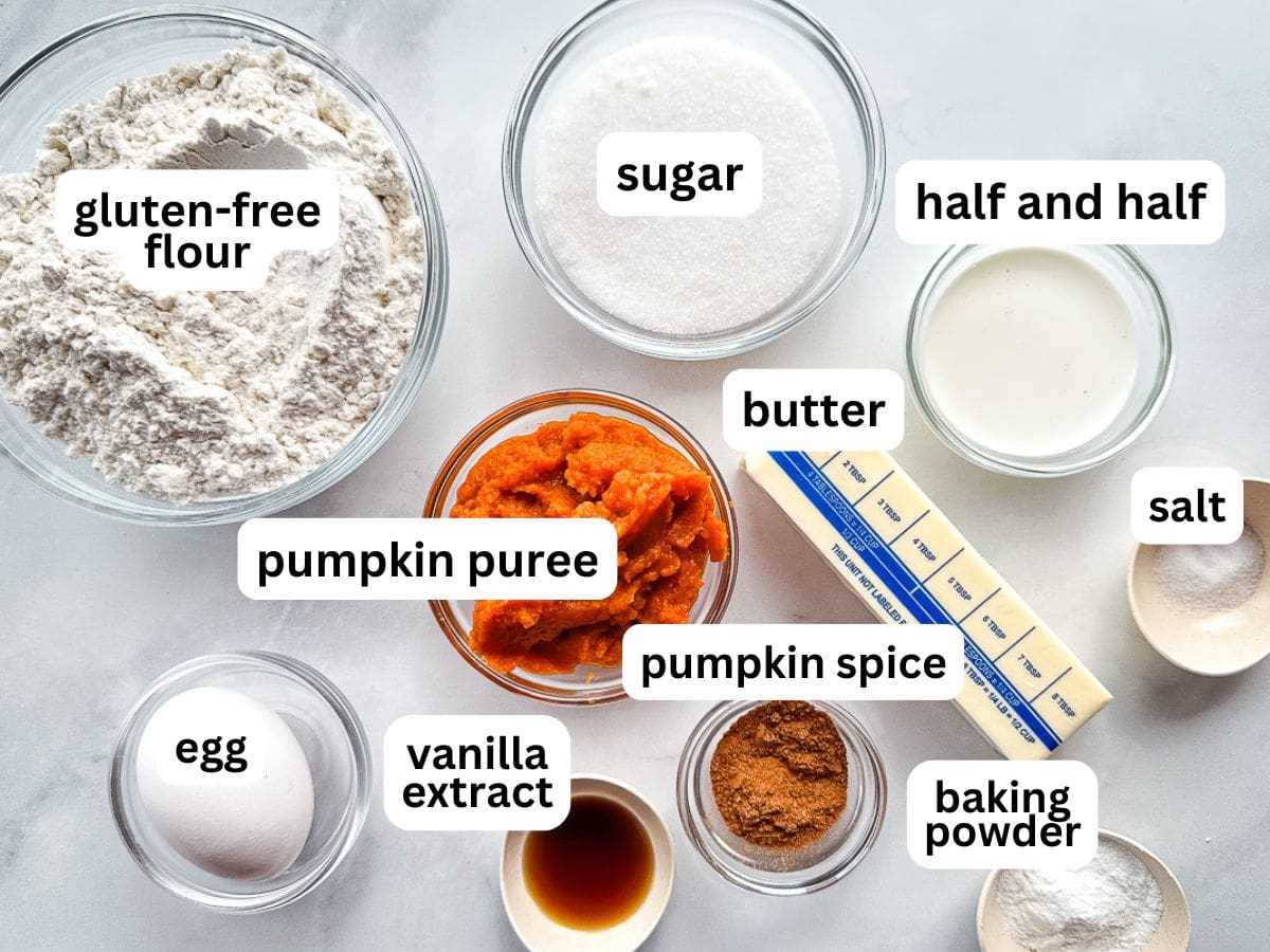 Ingredients for gluten-free pumpkin scones measured and individual bowls on the counter.